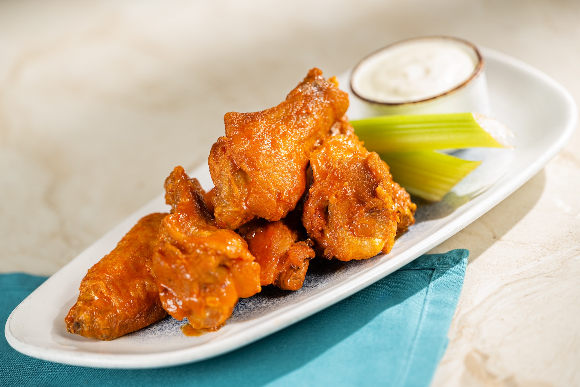 Buffalo chicken wings served with celery and dipping sauce
