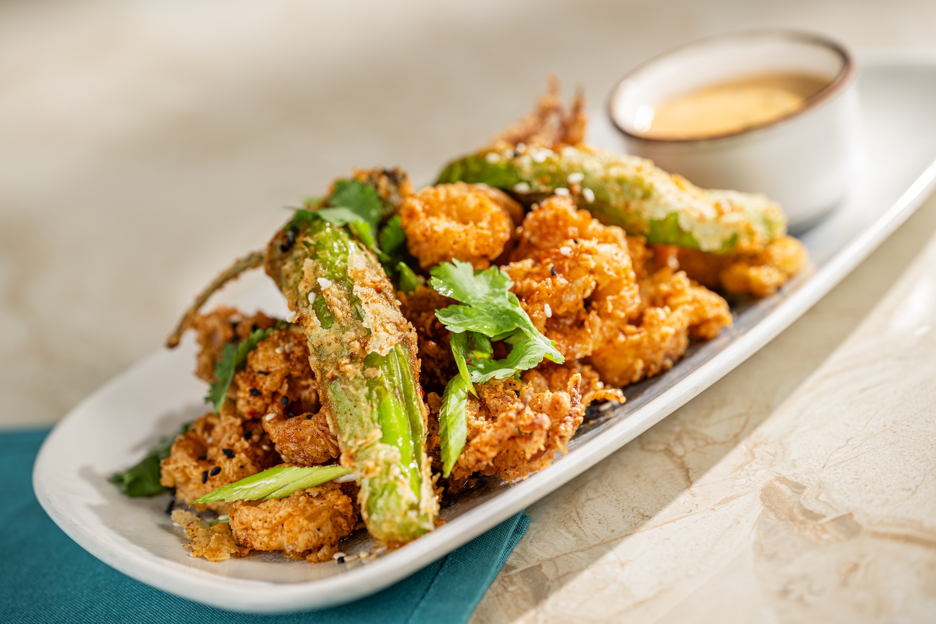 Golden fried calamari with vegetables and dipping sauce