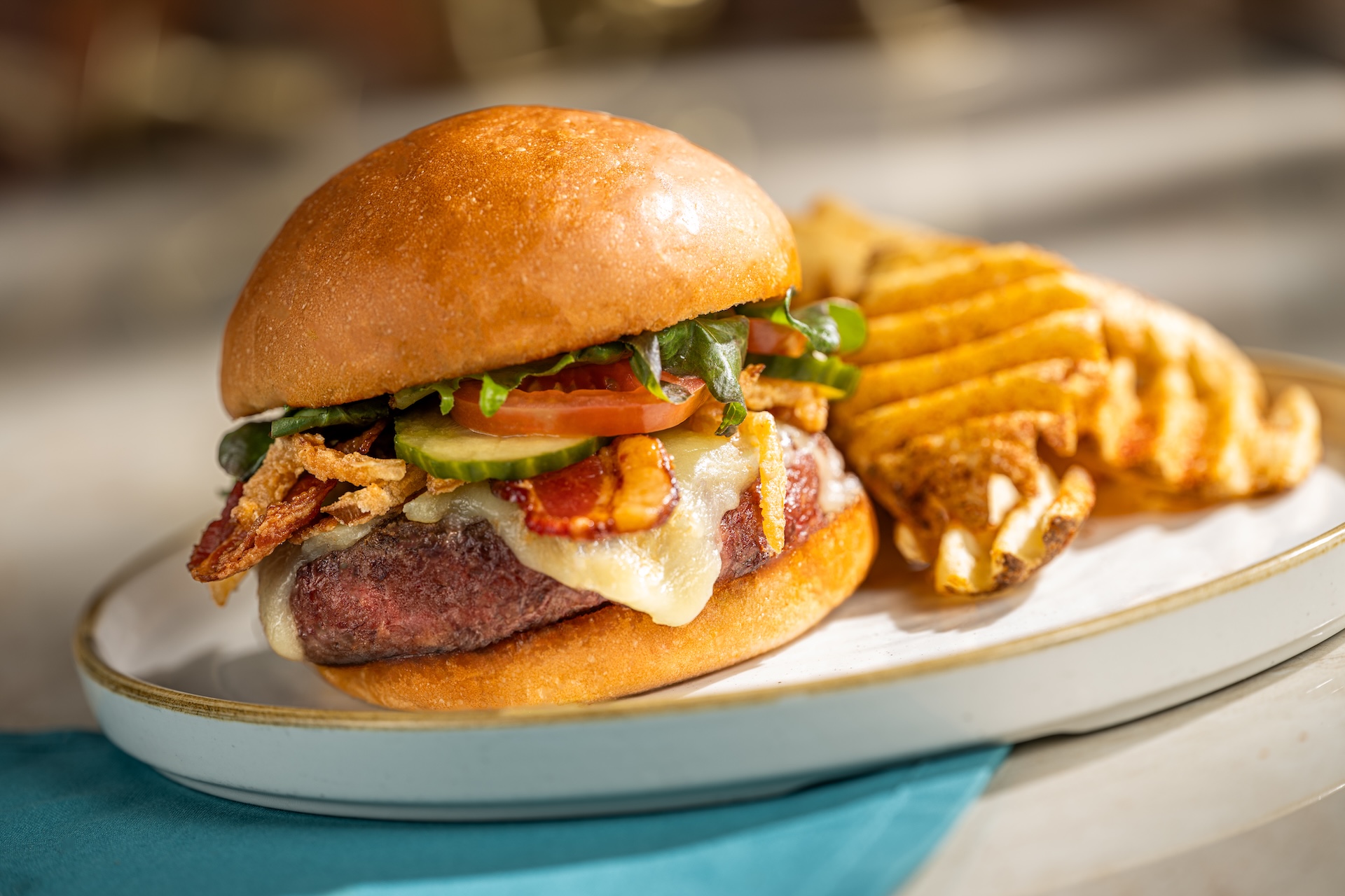 Turf Club burger with waffle fries