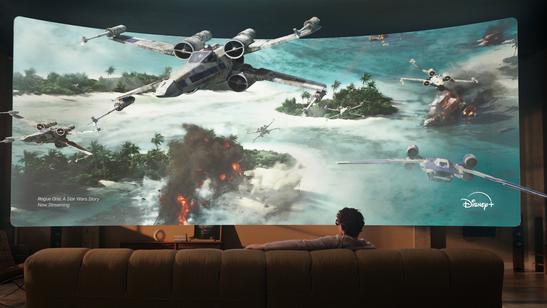 Disney+ Rogue One displayed across an immersive virtual screen while a viewer sits on a couch