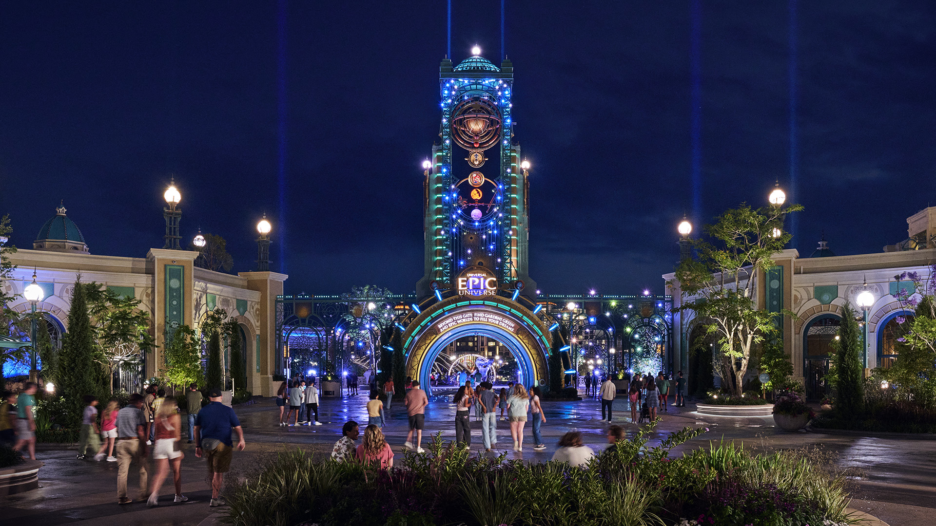 Universal Epic Universe entrance and Chronos tower illuminated at night