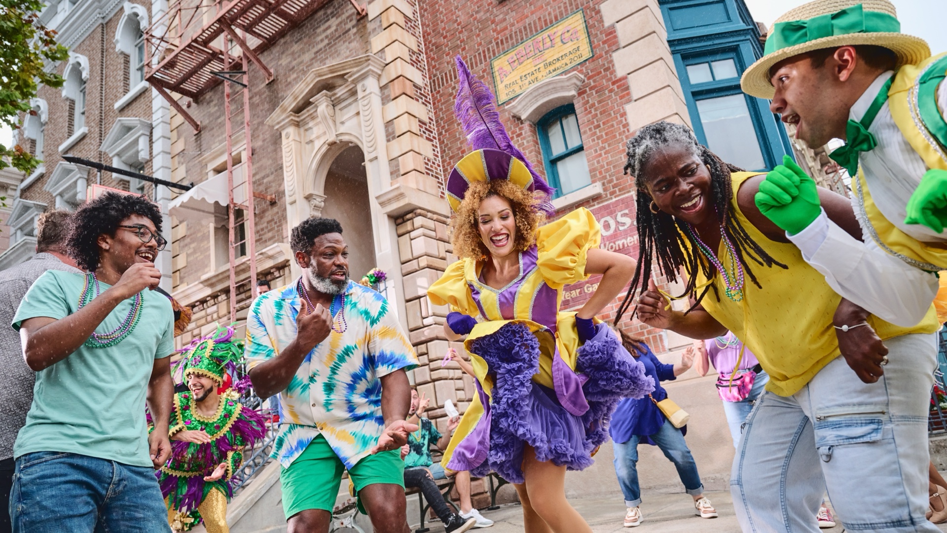 Mardi Gras performers dance with guests at Universal Studios Florida