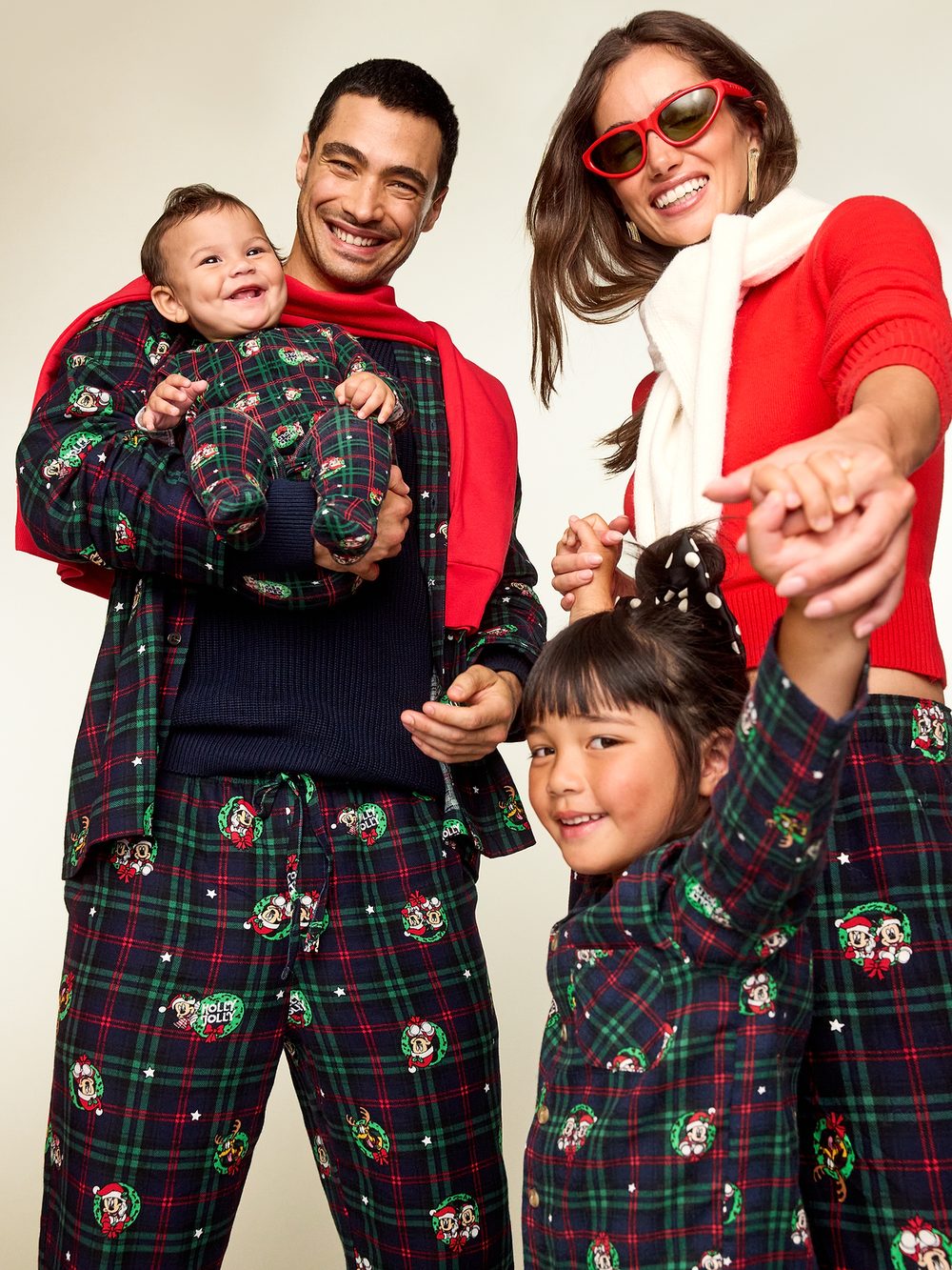 Family wearing coordinated red and green Old Navy holiday clothing