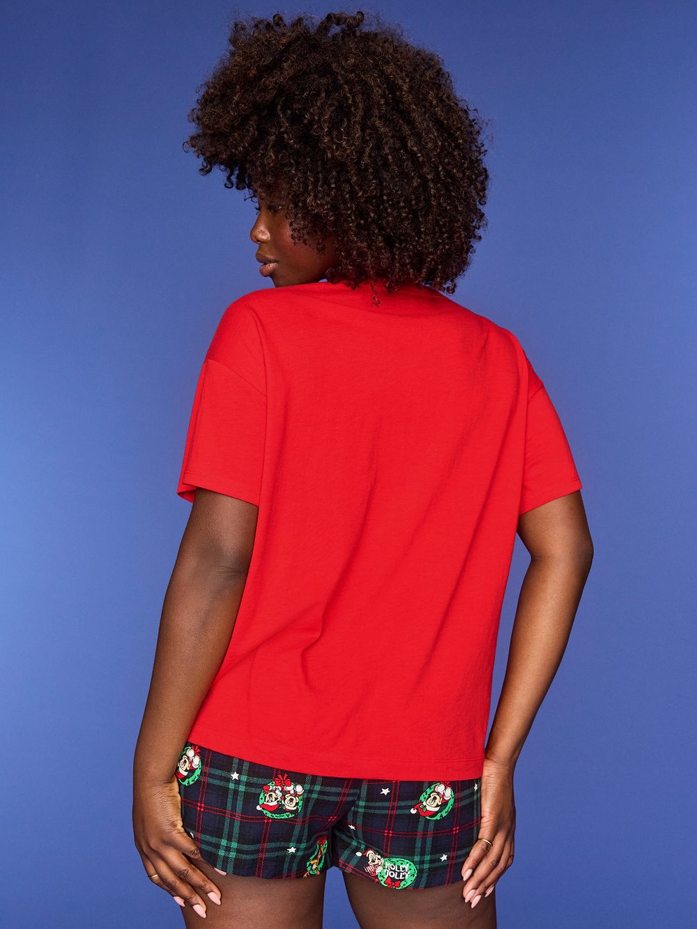 Model showing the back of the red Old Navy x Disney holiday T-shirt