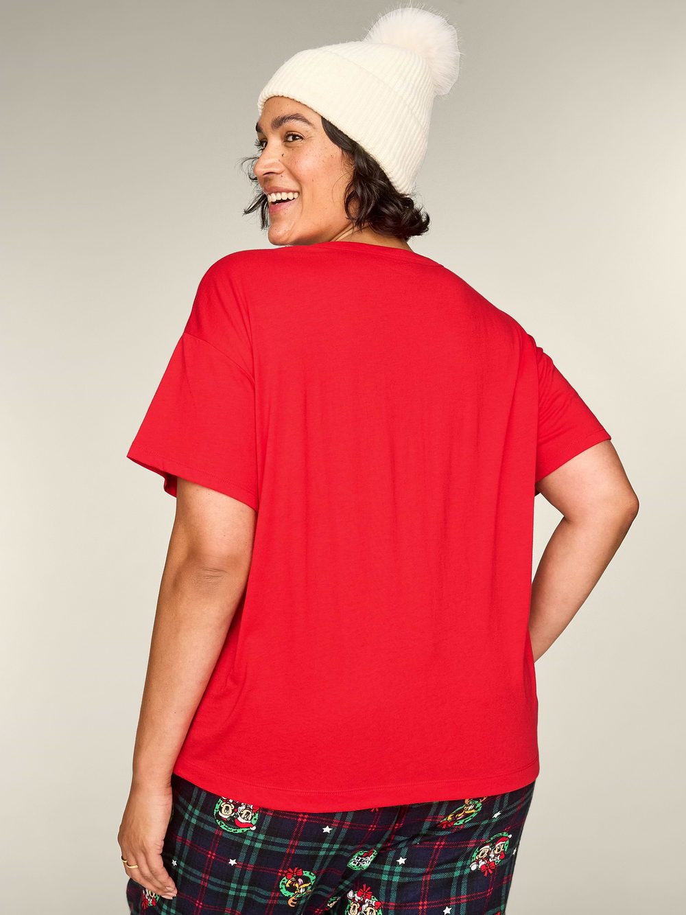 Back view of a model wearing the red Disney holiday T-shirt
