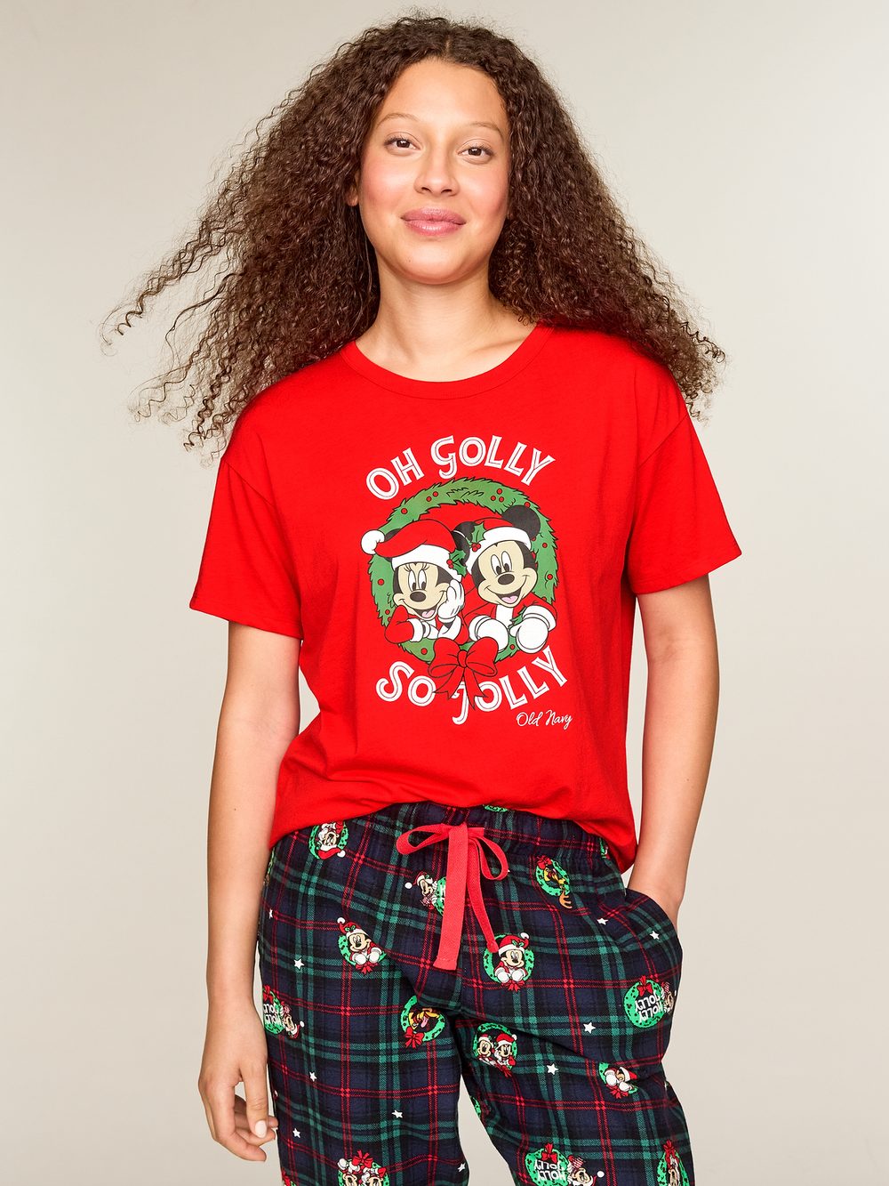 Model wearing the red Old Navy x Disney Mickey and Minnie holiday wreath T-shirt