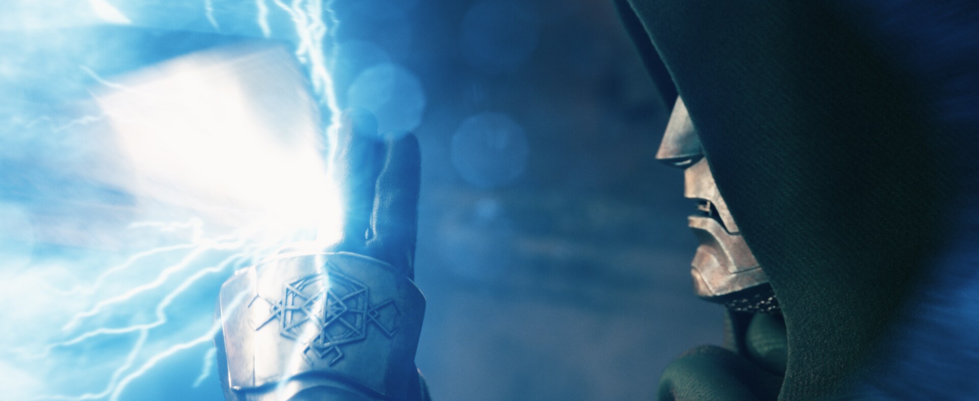 Doctor Doom raises a glowing armored hand in an Avengers: Doomsday trailer still