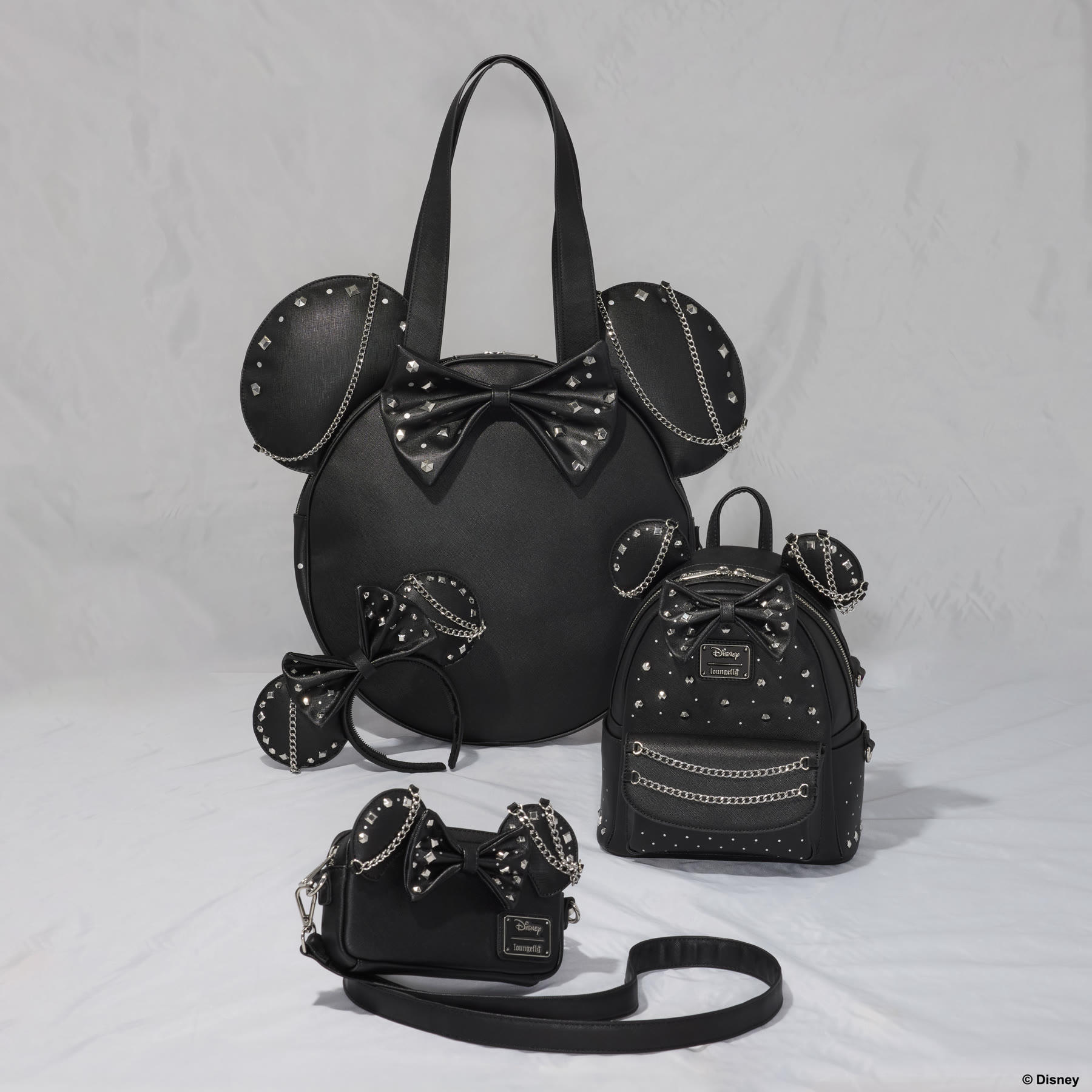 Model wearing the Minnie Mouse Studs and Chains mini backpack