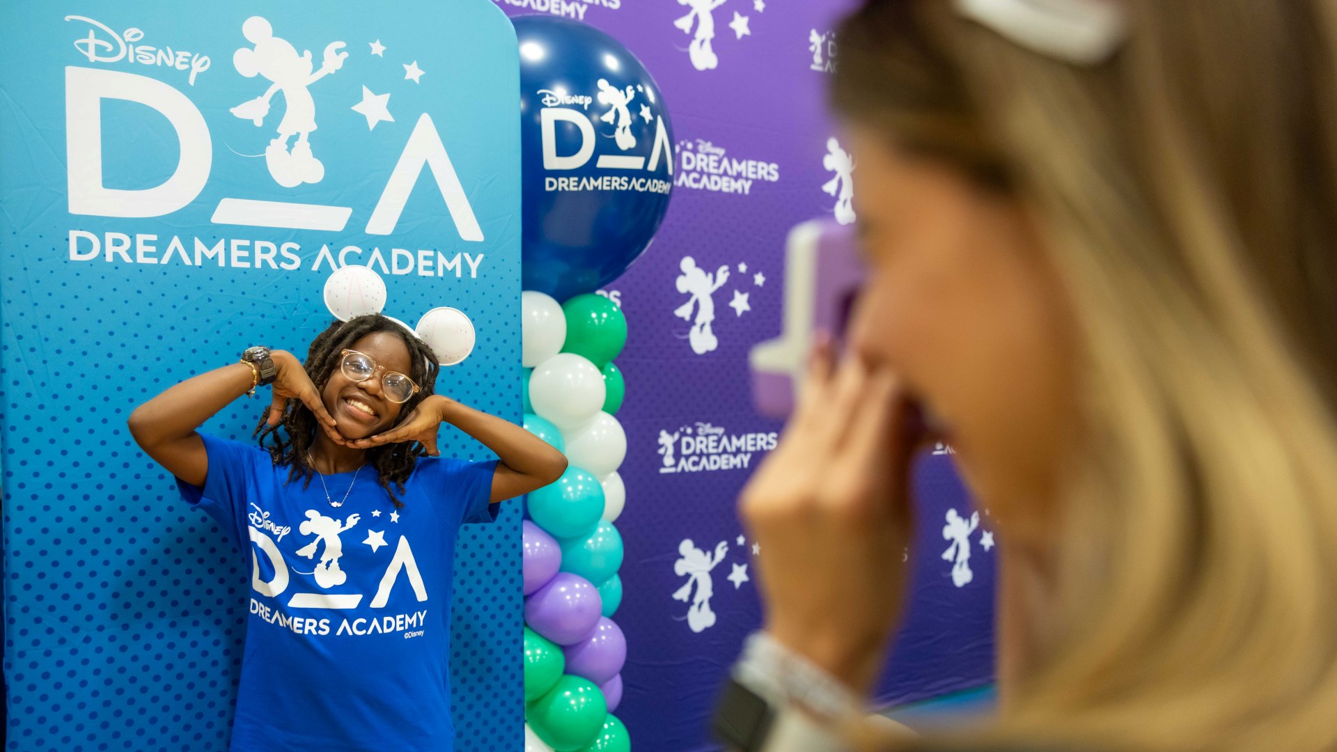 A Central Florida student poses at a Disney Dreamers Academy kickoff gathering