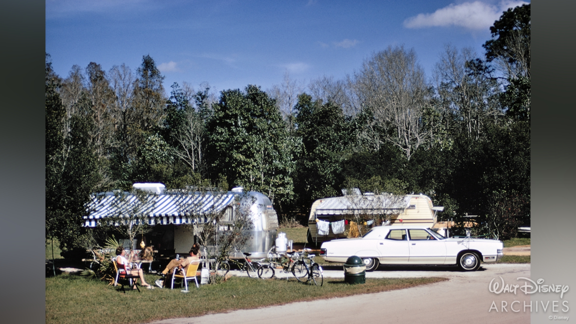 A family relaxes outside an Airstream trailer at Fort Wilderness in February 1972
