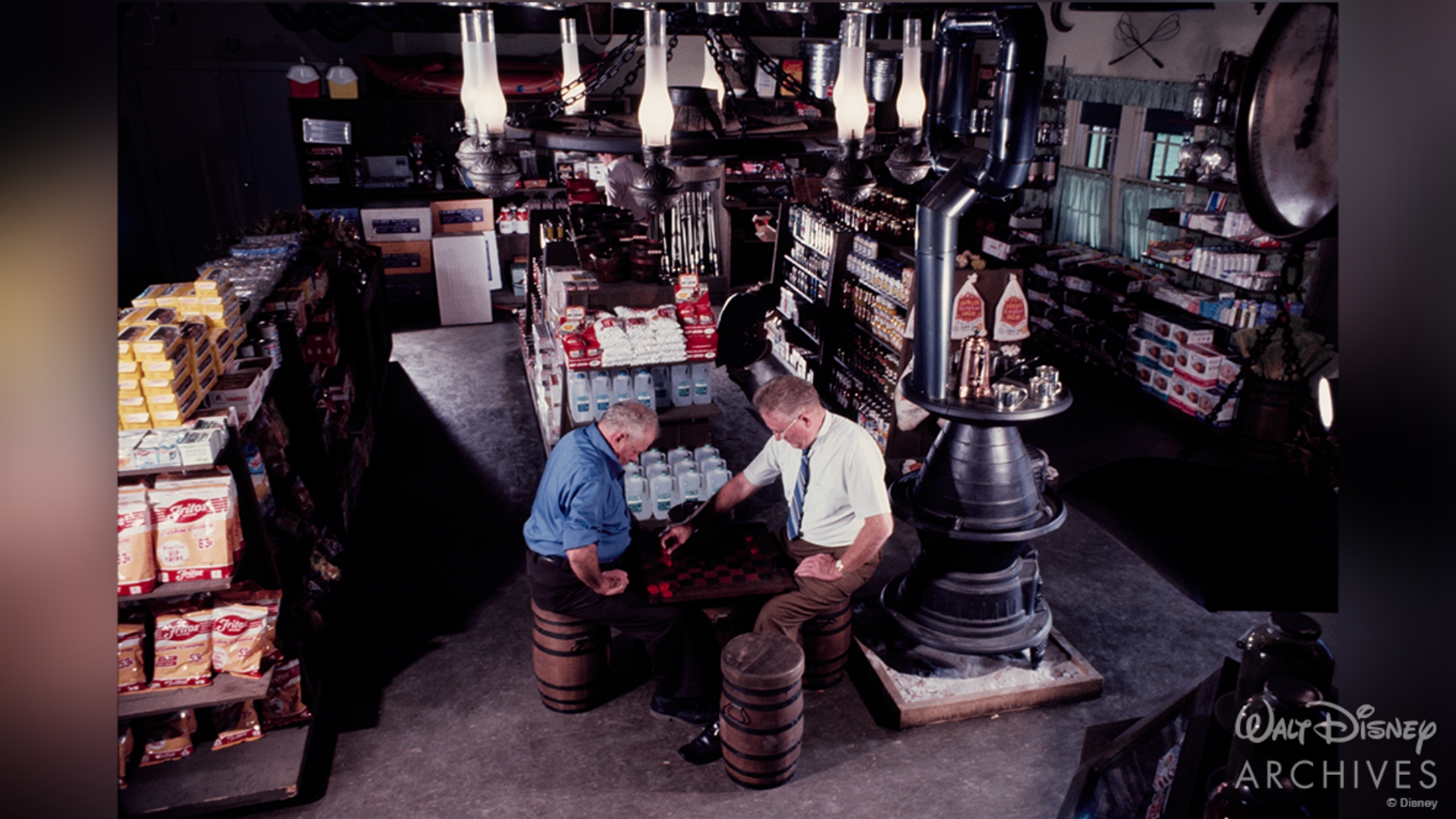 Two guests play checkers inside the Settlement Trading Post in January 1972