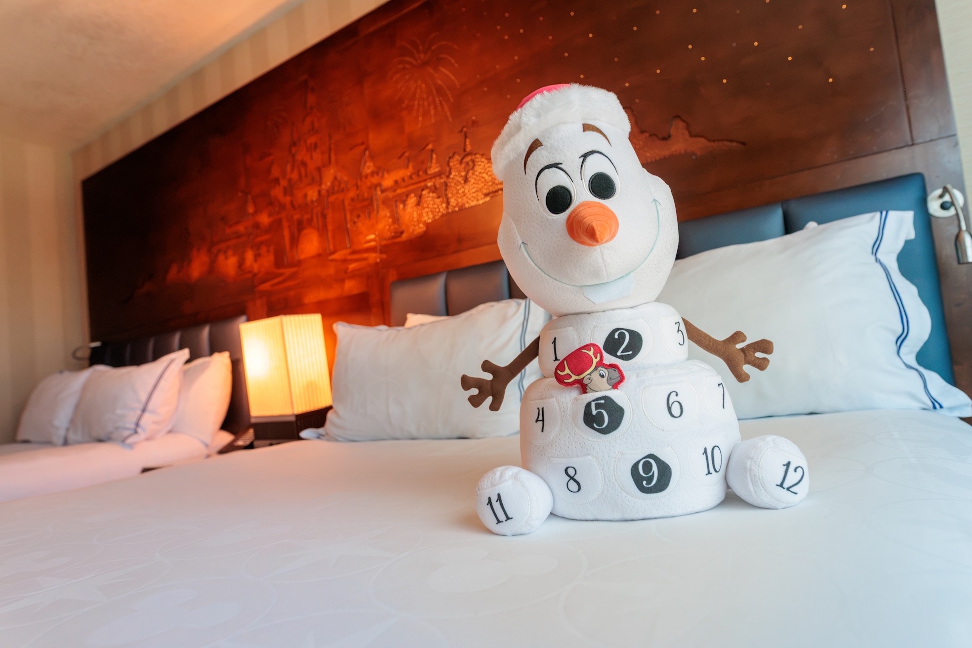 Olaf countdown plush displayed in a Frozen-themed hotel room