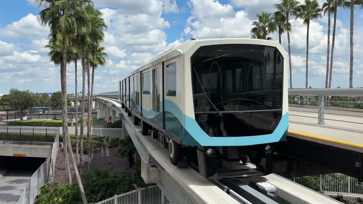 A new Gate Link tram stands at an Orlando International Airport station