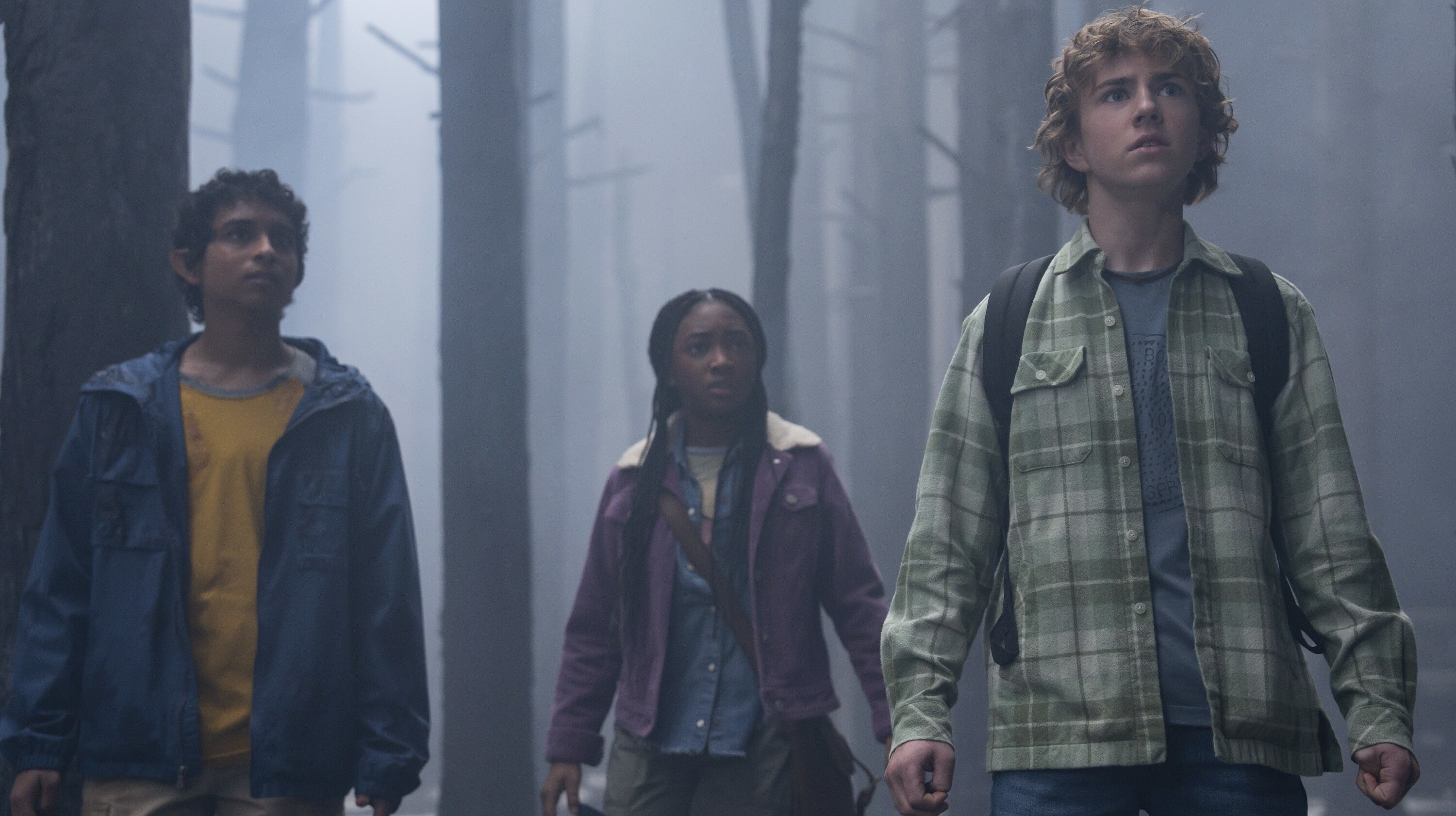 Percy, Annabeth and Grover stand together in Percy Jackson and the Olympians