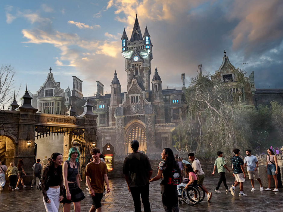 Guests walk toward Frankenstein Manor, home of Monsters Unchained at Epic Universe