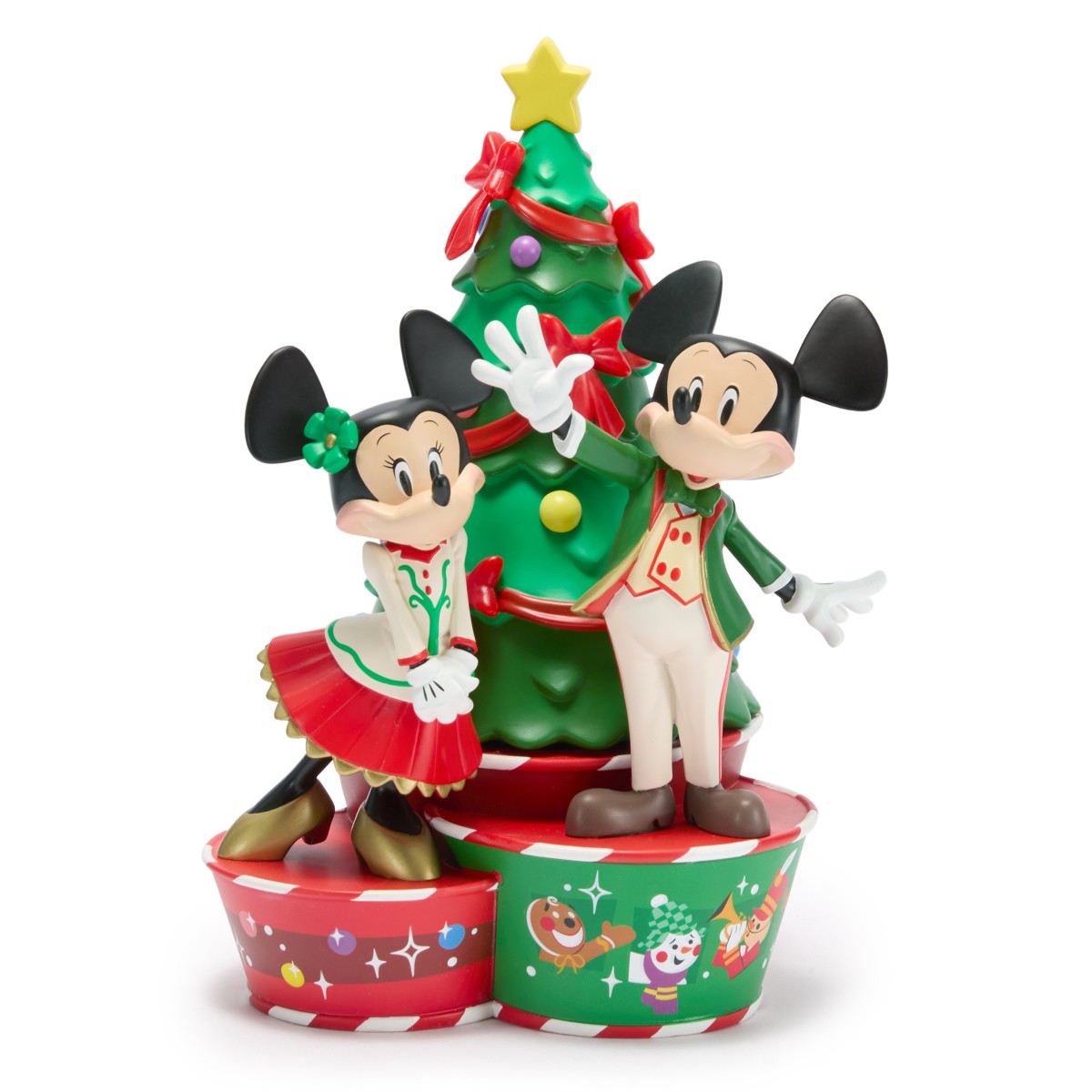 Mickey and Minnie Mouse pose beside a Christmas tree in Tate Yotter holiday figure