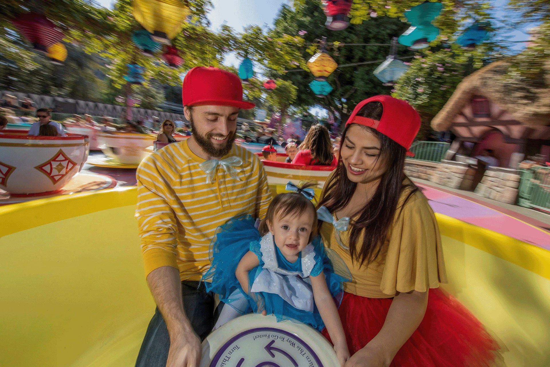 A family rides Mad Tea Party at Disneyland Park