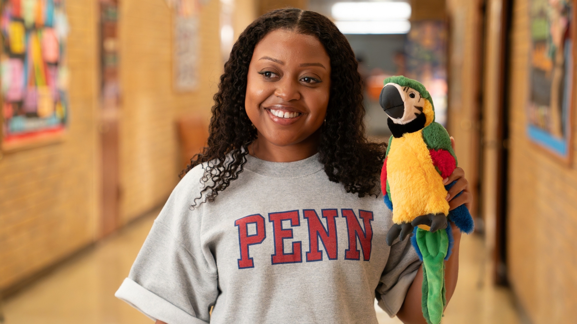 Quinta Brunson as Janine Teagues holds a parrot plushie in an Abbott Elementary Season 6 scene