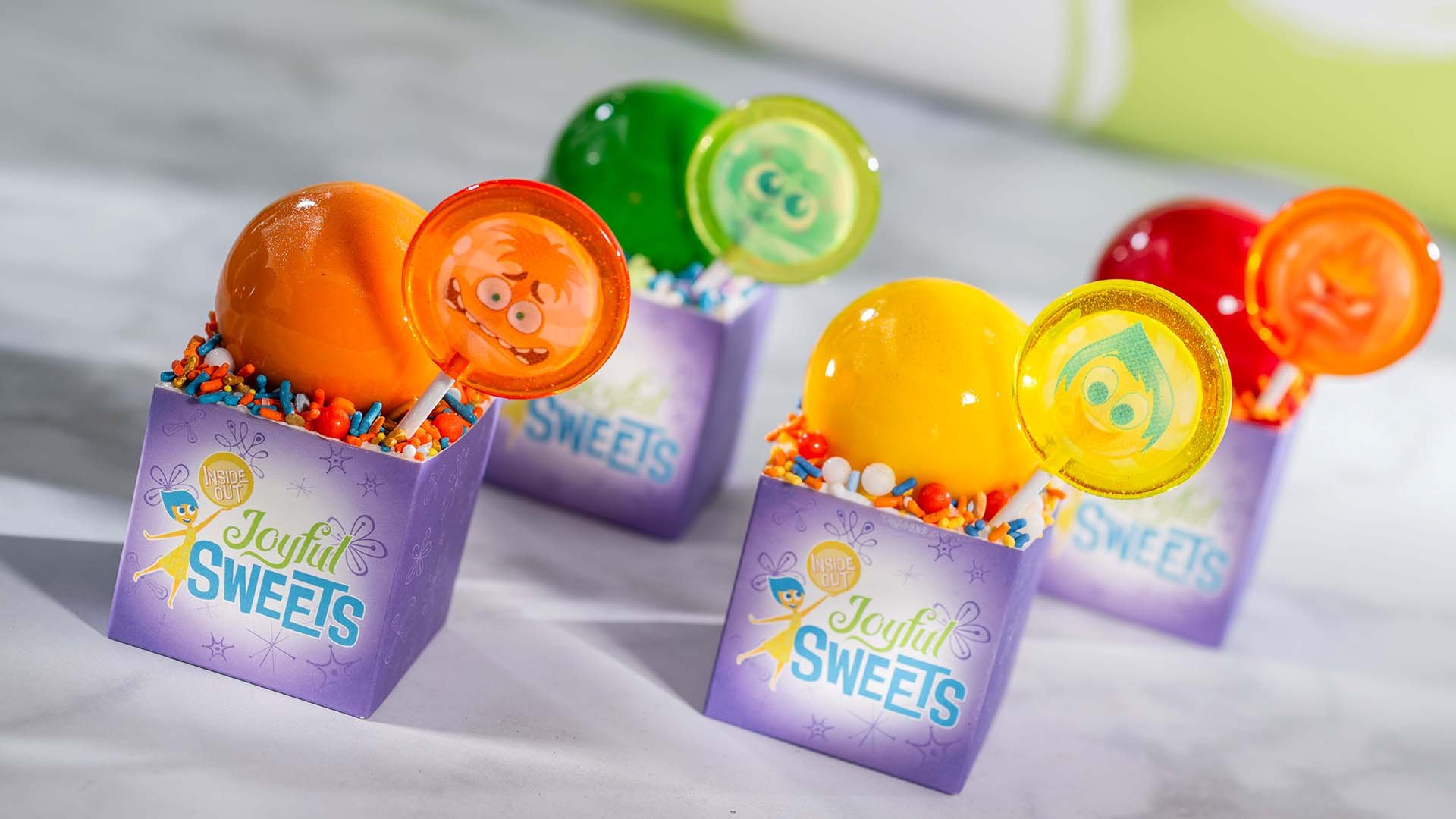 Colorful Inside Out cupcakes planned for Joyful Sweets aboard Disney Believe