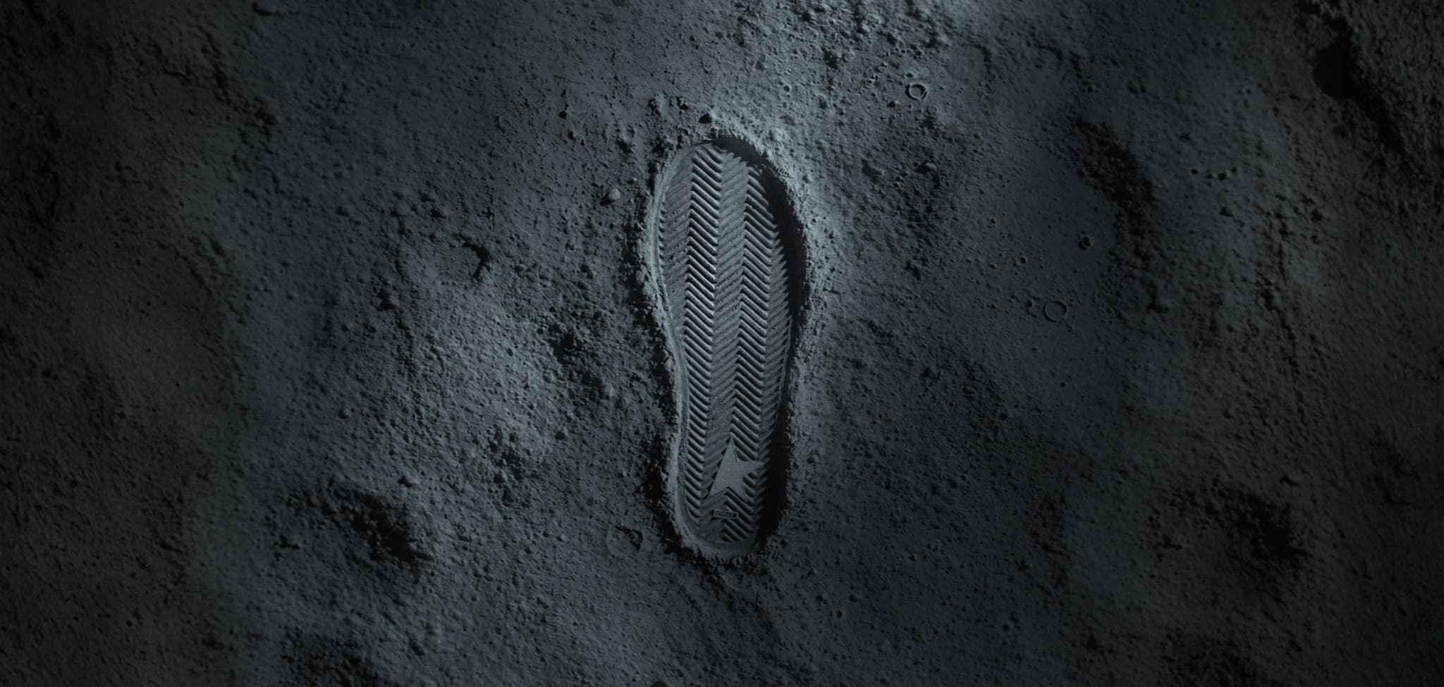 A Golden Goose shoeprint pressed into a moonlike surface in the Disney collaboration teaser