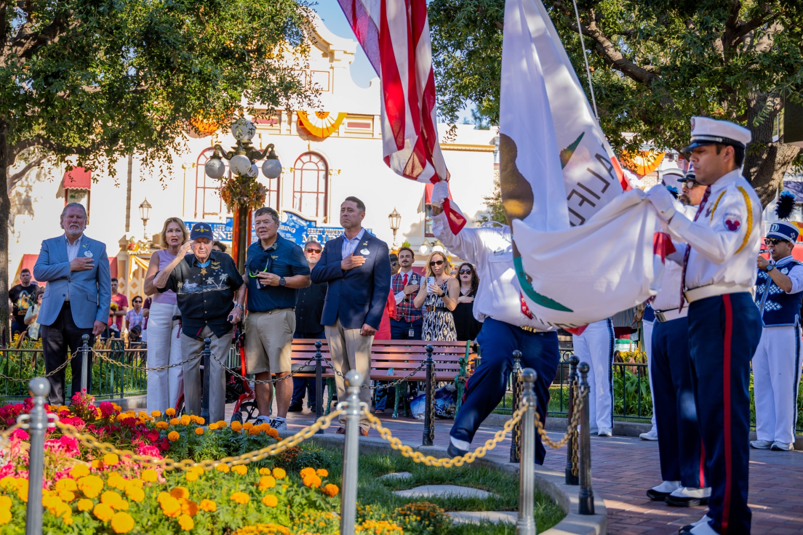 Royce Williams salutes during the Flag Retreat ceremony at Disneyland