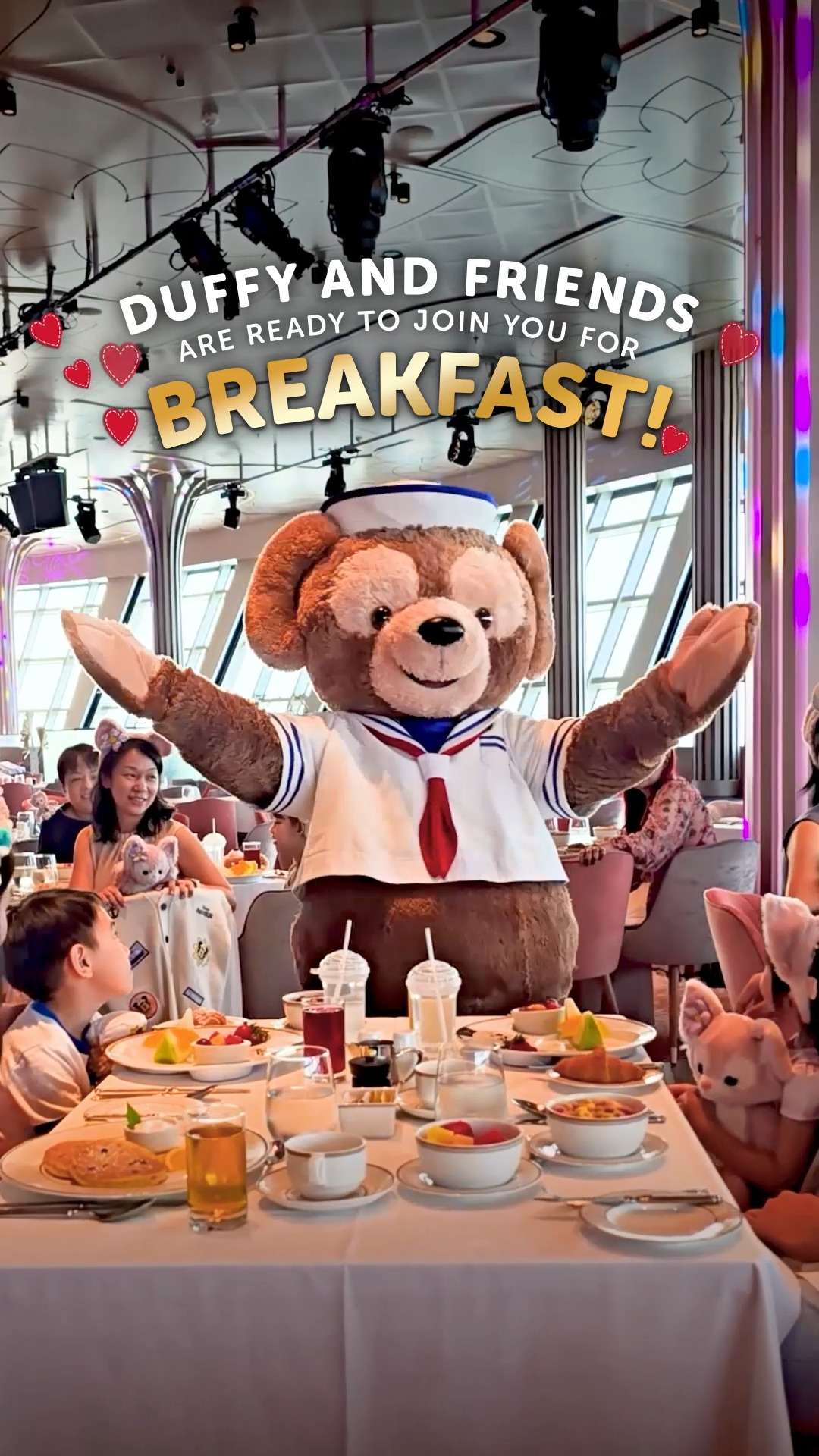 Duffy welcomes guests to the announced breakfast at Hollywood Spotlight Club aboard Disney Adventure
