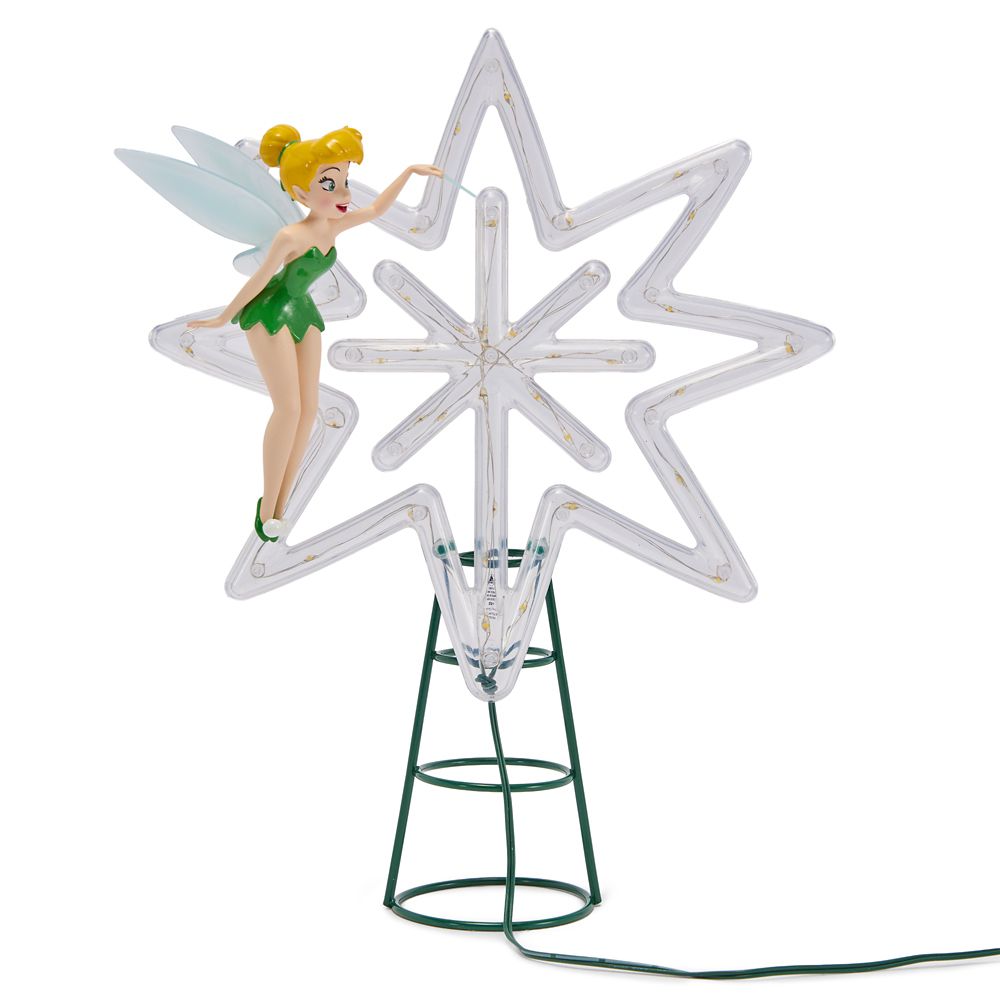 Tinker Bell figure beside a clear illuminated star on a green metal spiral tree-top base