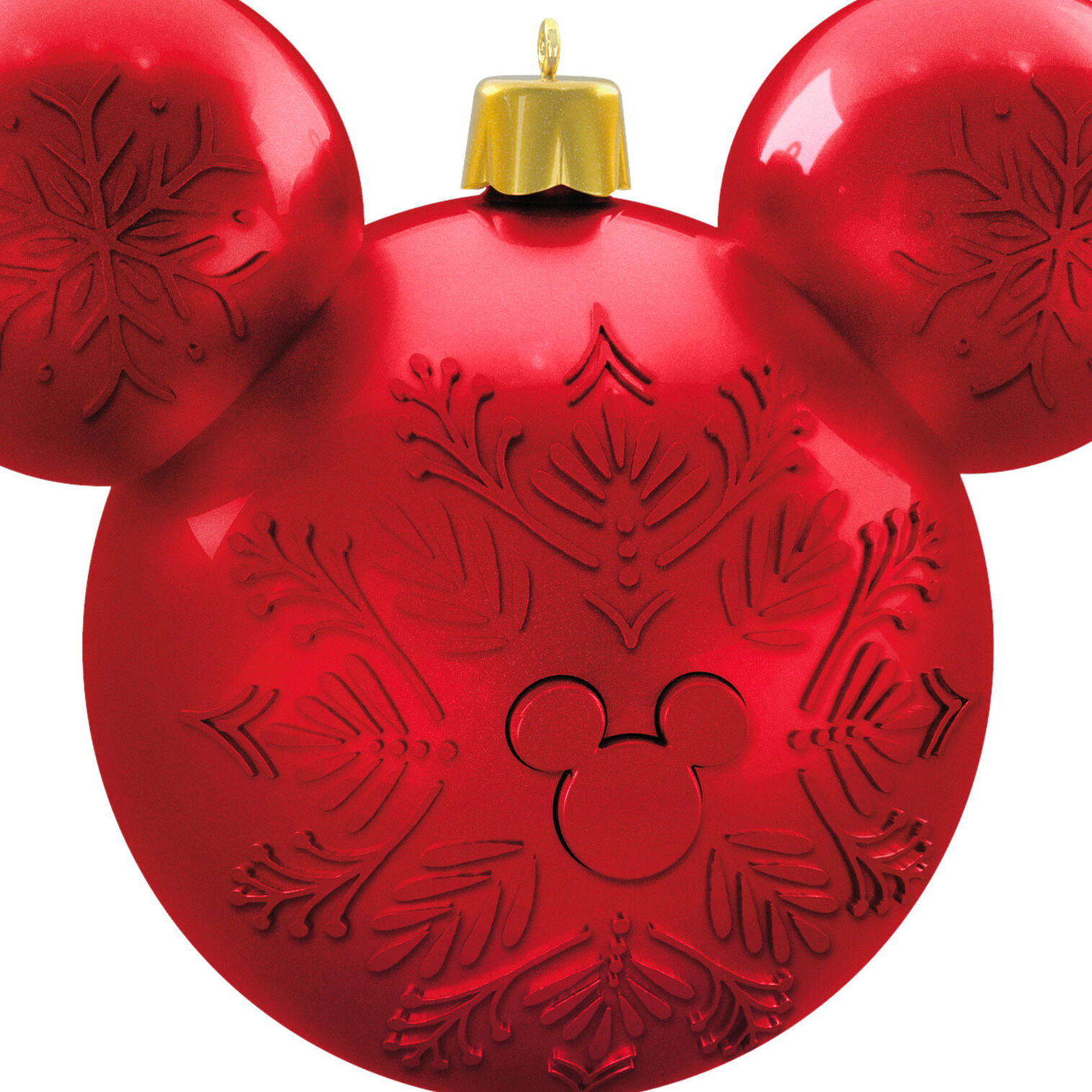 Close view of the red ornament’s snowflake pattern and Mickey icon.