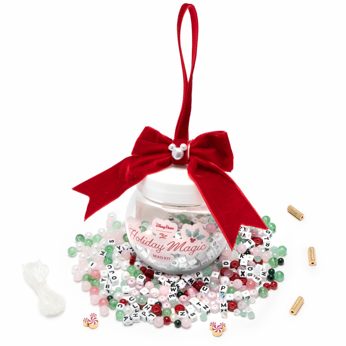 Disney Parks Holiday Magic Bead Kit arranged around its clear ornament container