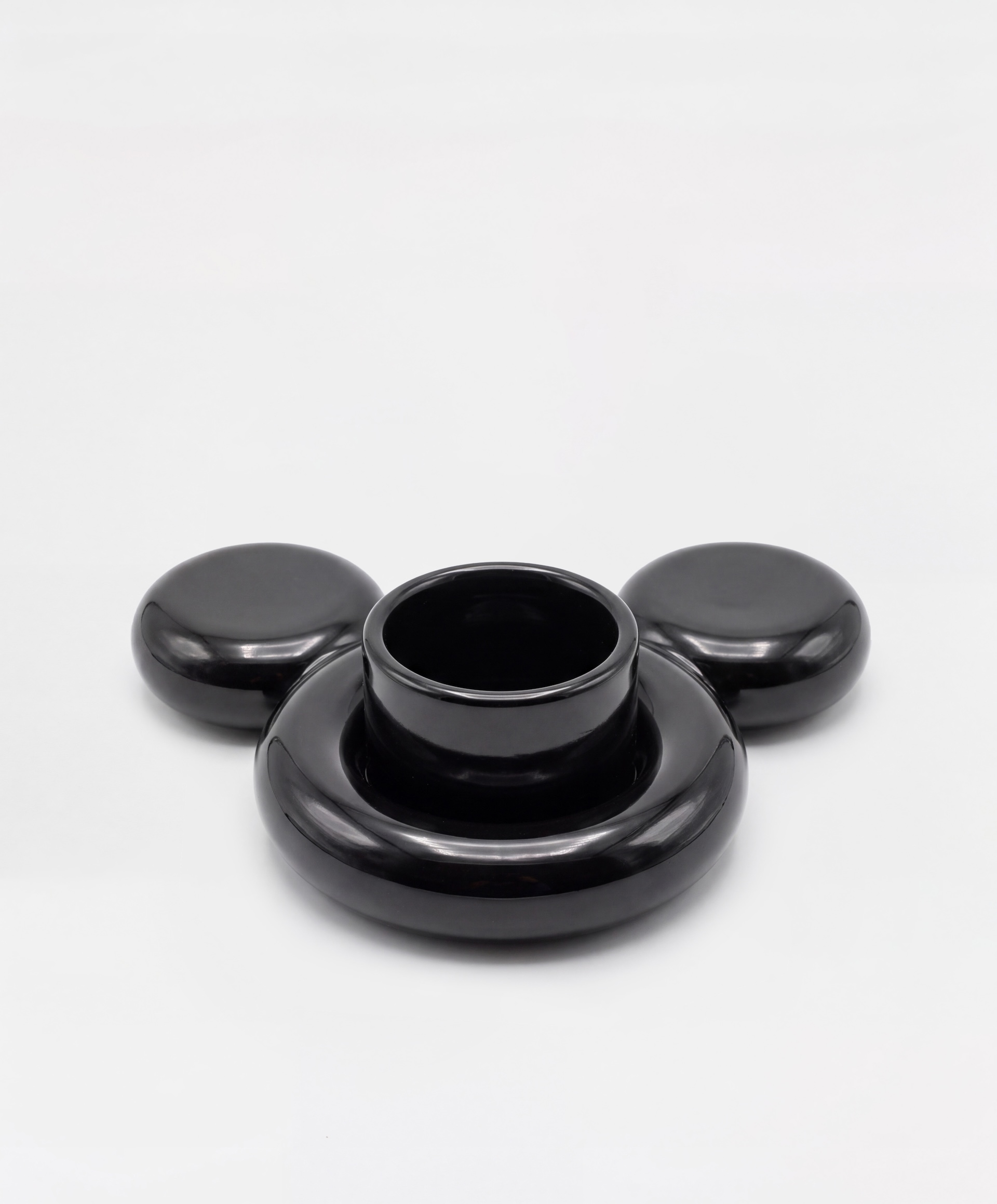 Black ceramic Gustaf Westman Mickey Mouse cup on a Mickey-shaped saucer