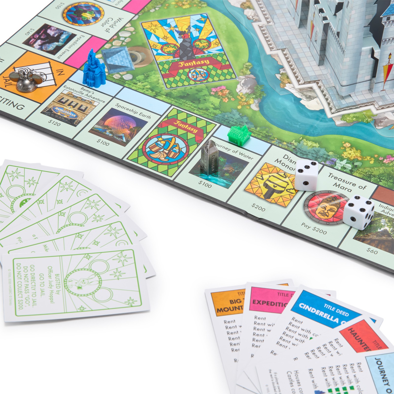 Close view of attraction properties and pieces on the Disney Parks Monopoly board