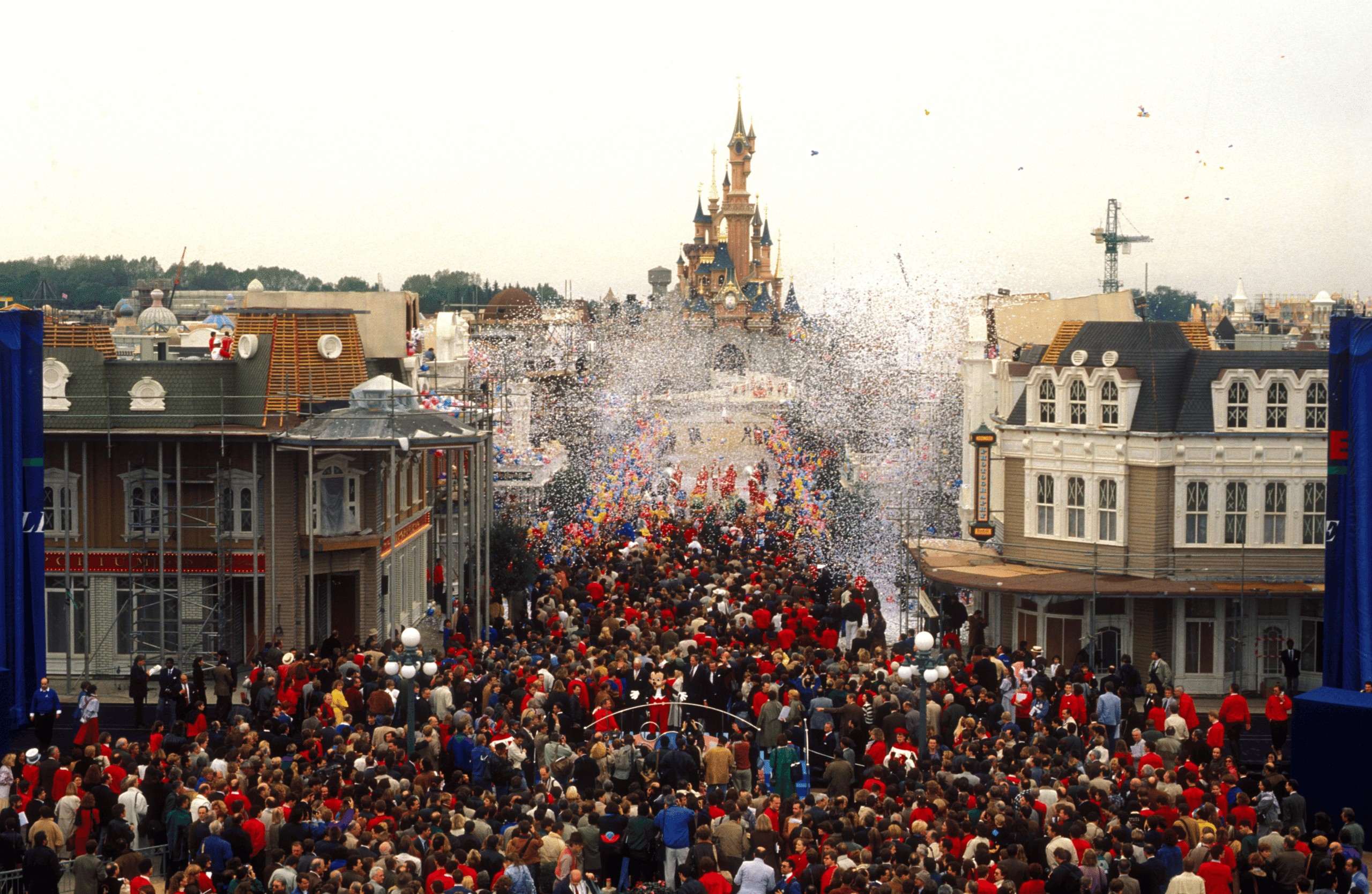 Crowds fill Main Street during the 1991 unveiling of Sleeping Beauty Castle