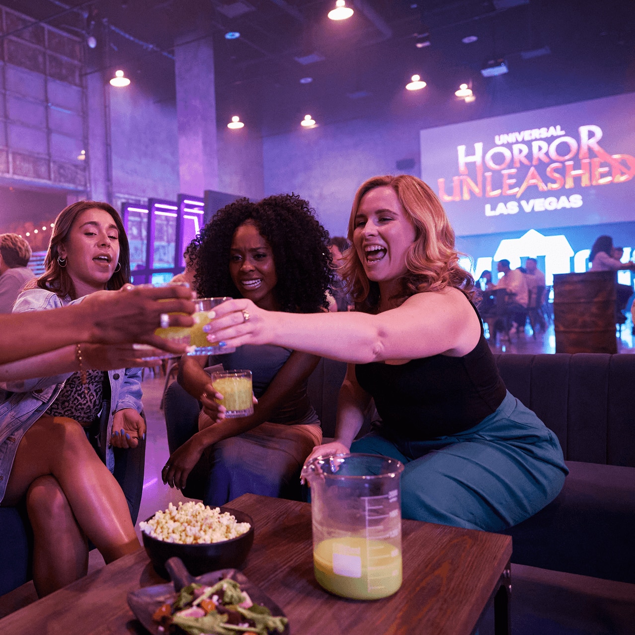 Guests toast drinks inside Universal Horror Unleashed in Las Vegas