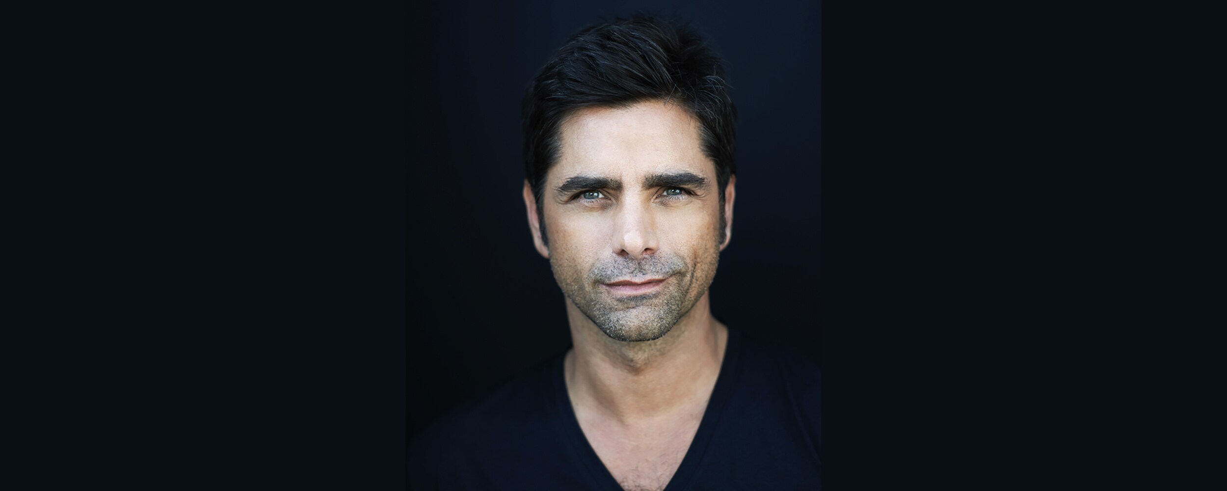 Official Disney portrait of John Stamos