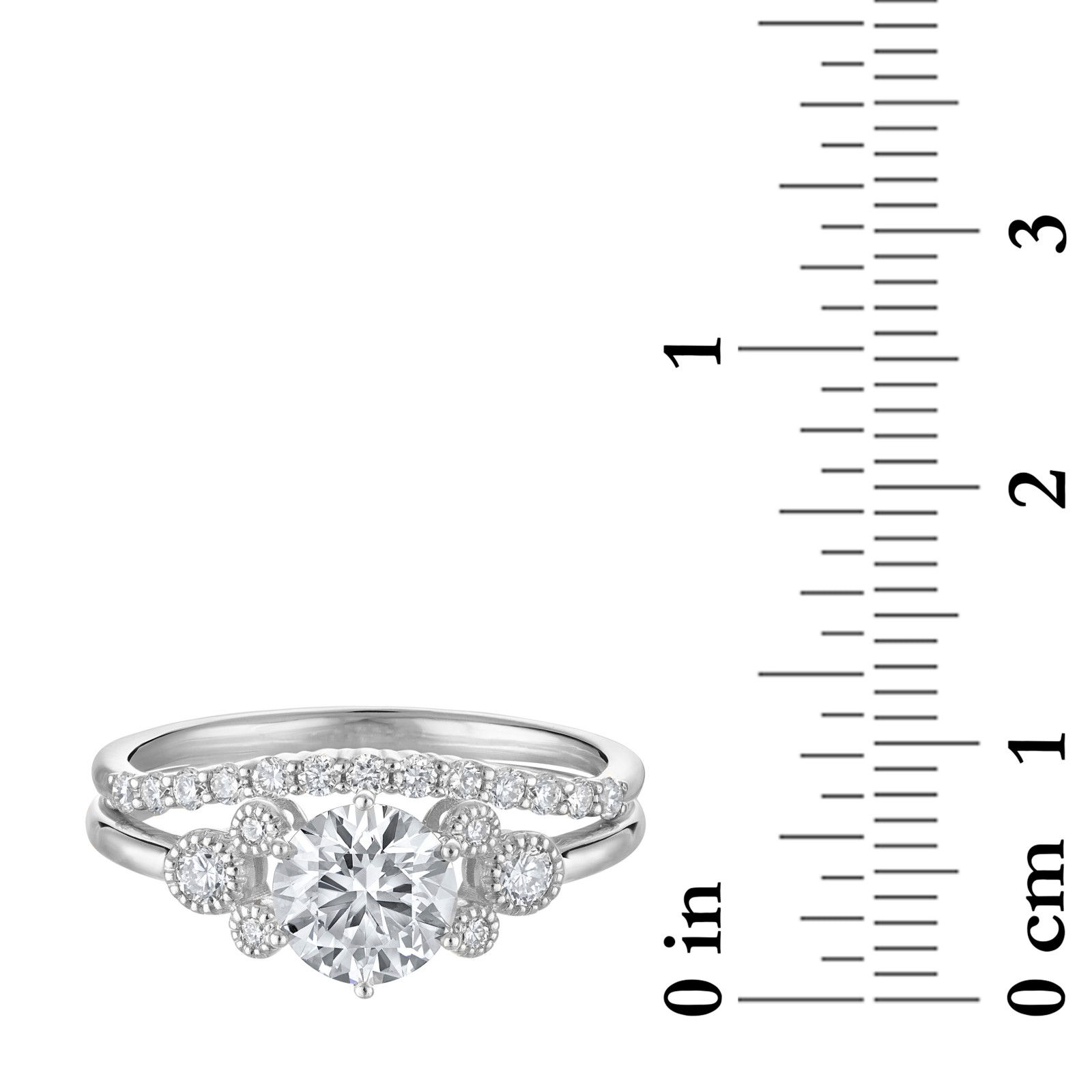 Rebecca Hook Mickey Mouse diamond engagement ring beside inch and centimeter scales