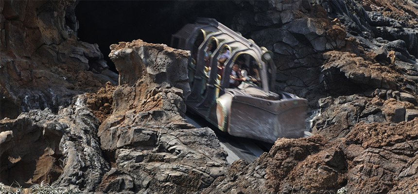 Journey to the Center of the Earth vehicle racing through a volcanic landscape