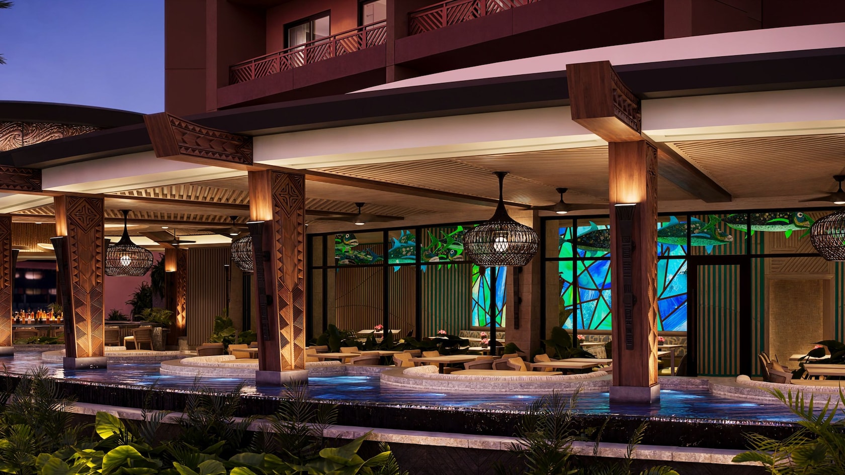 Outdoor seating and water features at Wailulu Bar & Grill