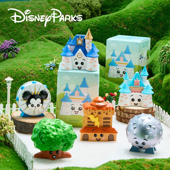 Six smiling Disney Parks landmark figures displayed with pastel mystery boxes