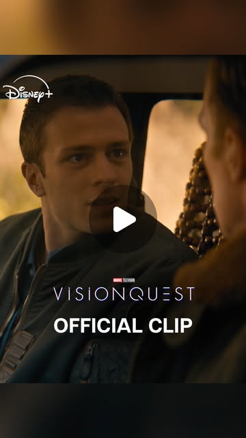 A young man looks toward another passenger in Marvel’s official VisionQuest clip