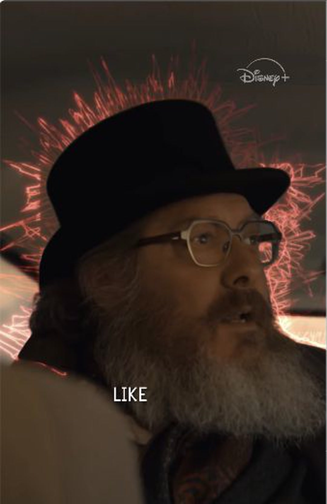 A bearded man in glasses and a dark hat in Marvel’s VisionQuest source-code promo