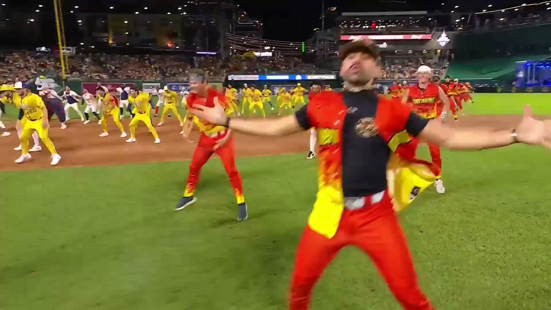 Banana Ball players perform on a baseball field
