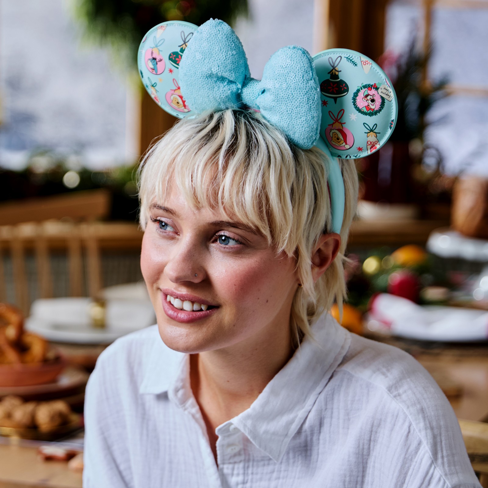 Model wearing the Winnie the Pooh holiday ear headband