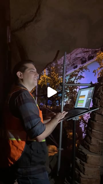 Imagineer working on lighting inside a Disneyland Railroad diorama in the official video
