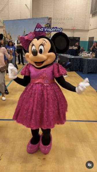 Minnie Mouse dances with Disney Dreamers at the Walt Disney World Clubhouse in Orlando