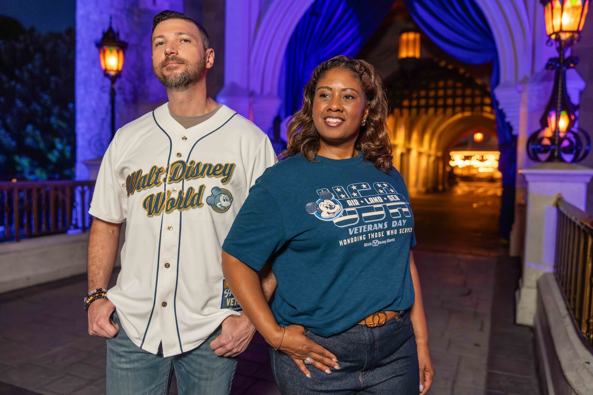 Two models wear the white Disney Veterans Day spirit jersey and blue Veterans Day T-shirt