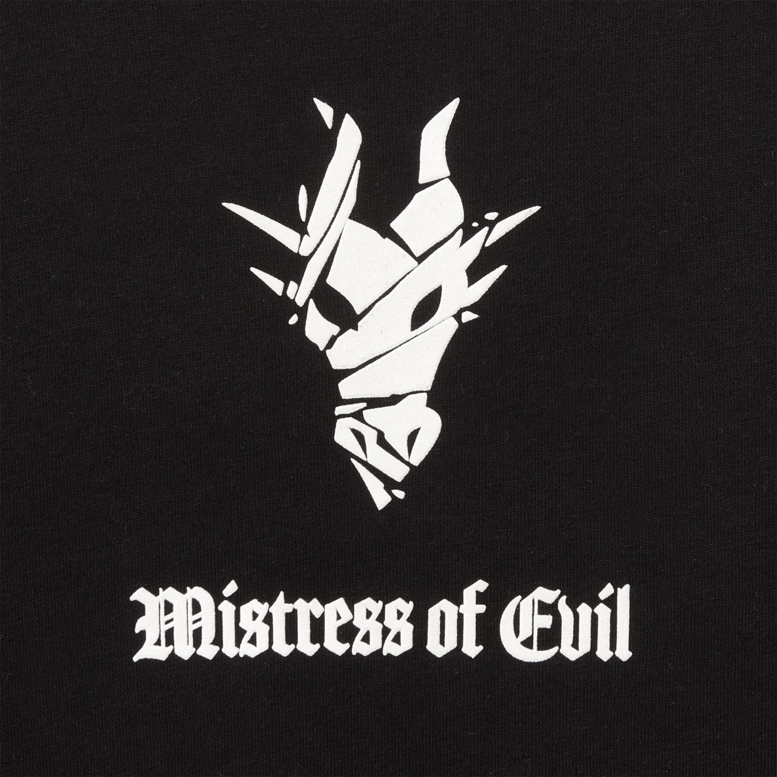 Close view of the dragon symbol and Mistress of Evil lettering