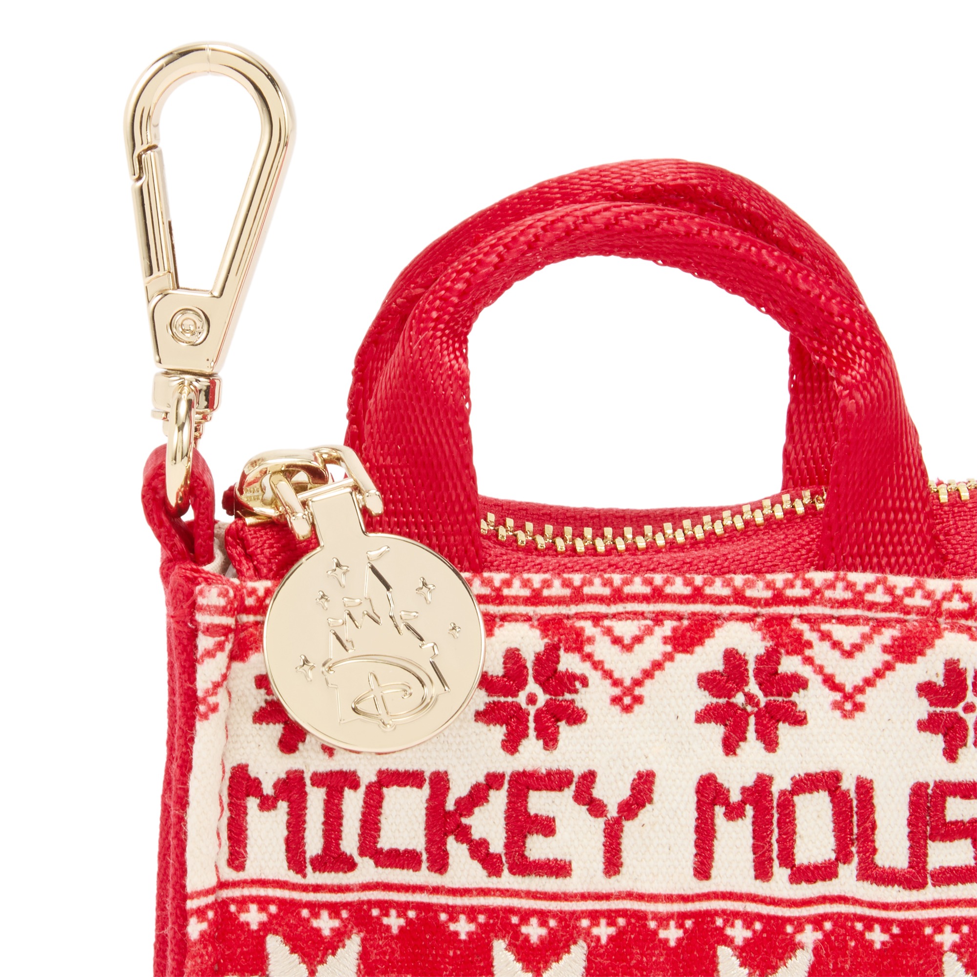 Close view of the micro tote charm’s lobster clasp and Disney charm