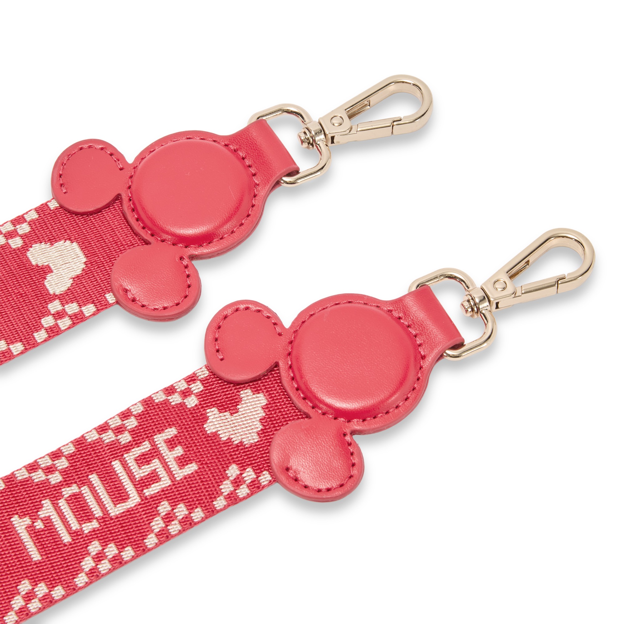 Close view of the strap’s Mickey icon tabs and lobster clasps