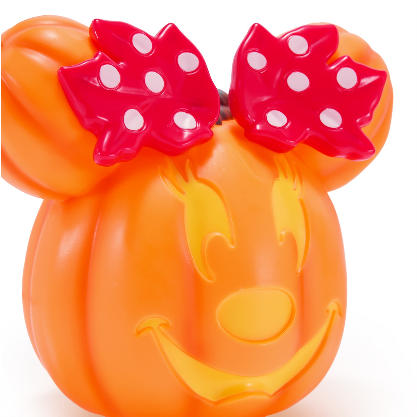 Close view of the Minnie Mouse jack-o’-lantern’s face and bow
