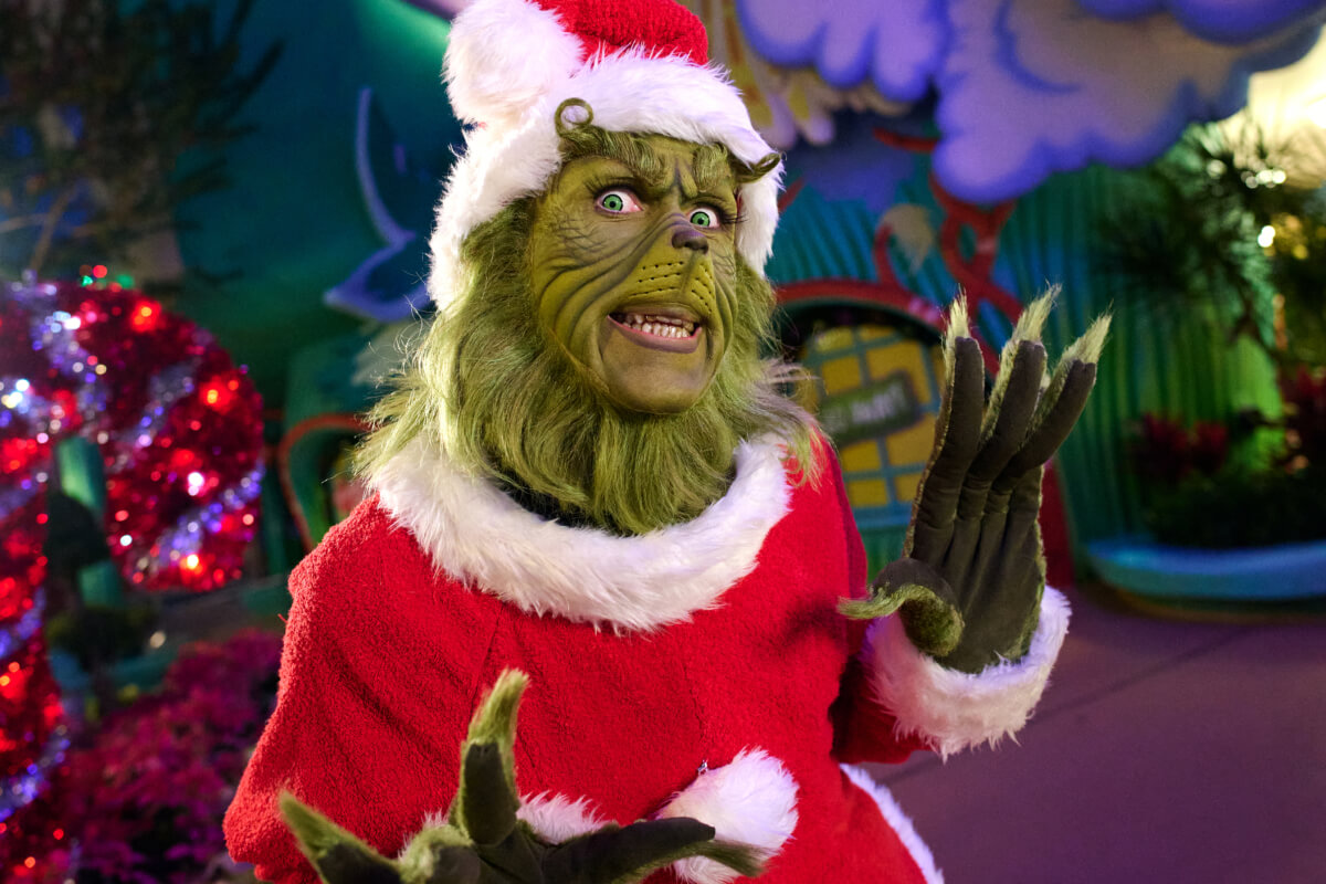 The Grinch dressed as Santa at Seuss Landing
